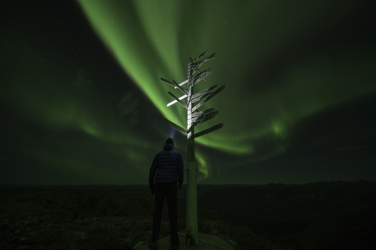 Northern lights above Keno signpost on Keno Hill, Keno, Silver trail, Yukon